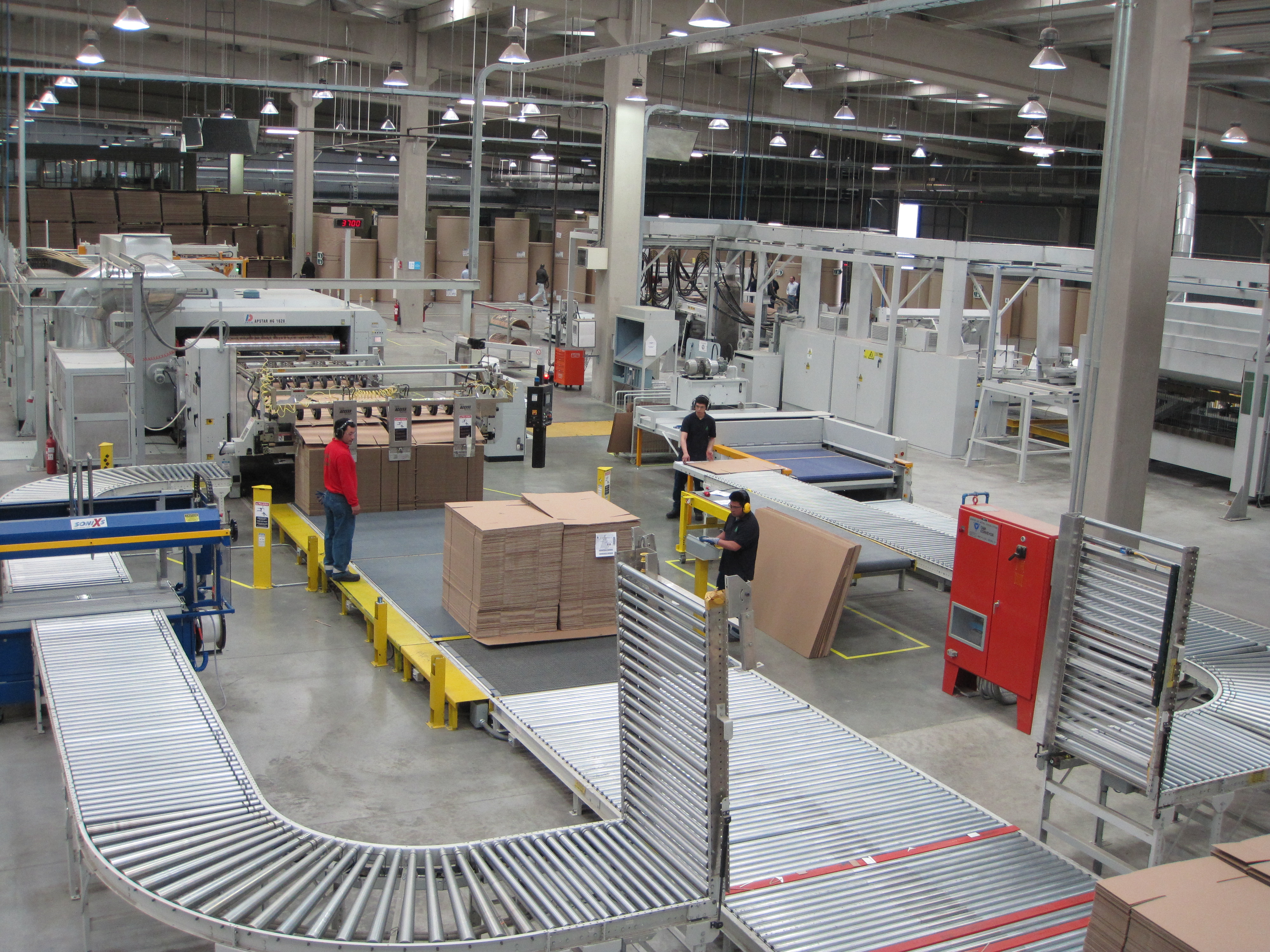 Goettsch production line system: Dong Fang Apstar rotary die cutter, Geo. M. Martin stacker, C & M conveyors and WSA load former.