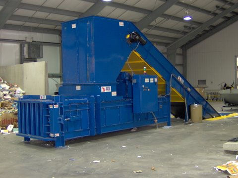 Shown is PW3560 manual tie baler with optional in-ground conveyor 